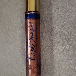 Senegence moisturizing lip gloss, glingersnap in color, mini, new in pkg
